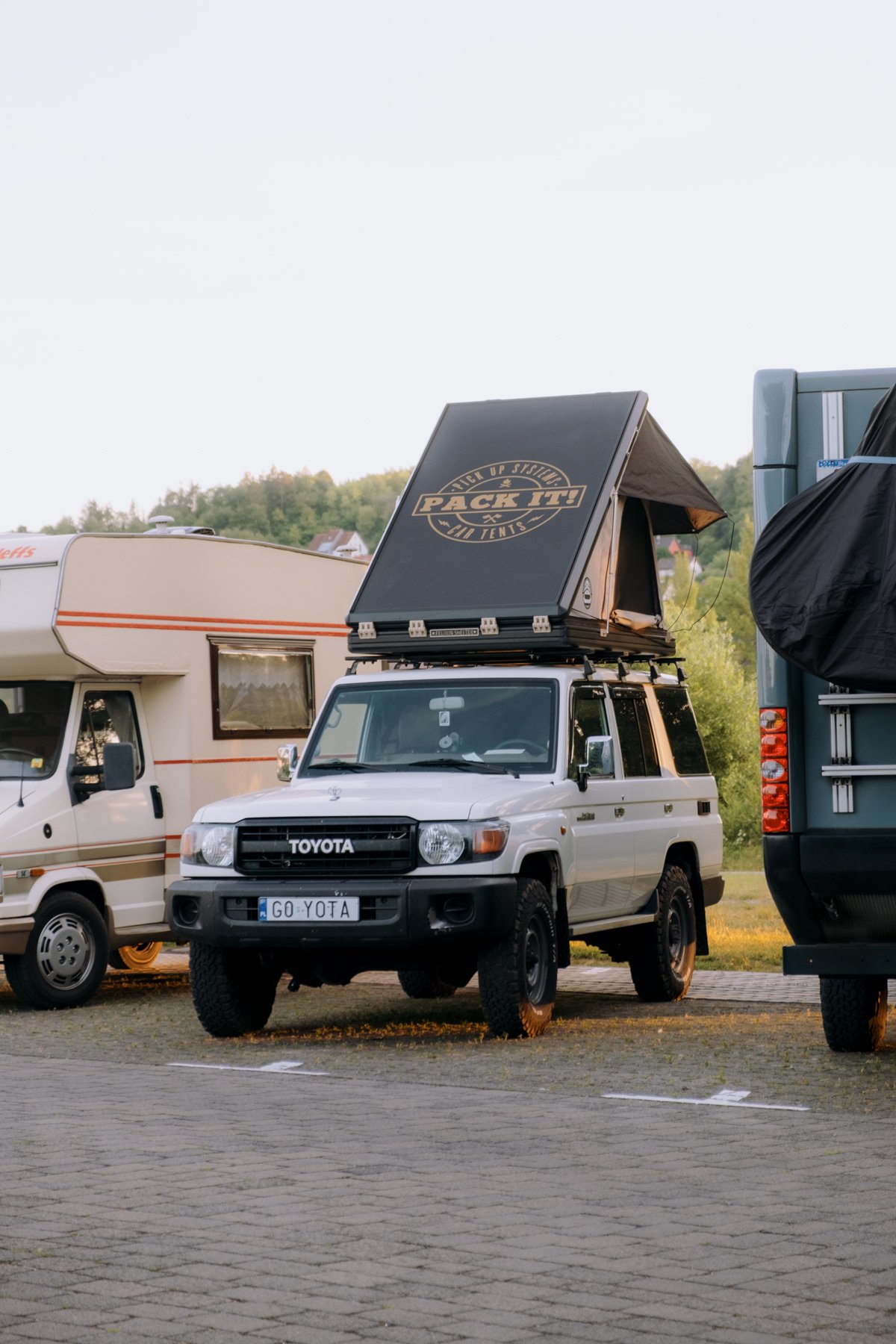Front view of a Land Cruiser 76 with the Hawk's Nest V2 rooftop tent closed at Abenteuer & Allrad